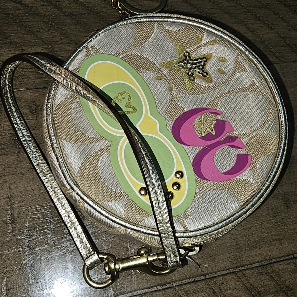 Coach Elegant Gold and Pink Clutch with Wristlet